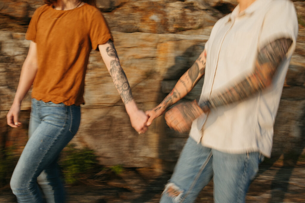 motion blur image of couple walking and holding hands