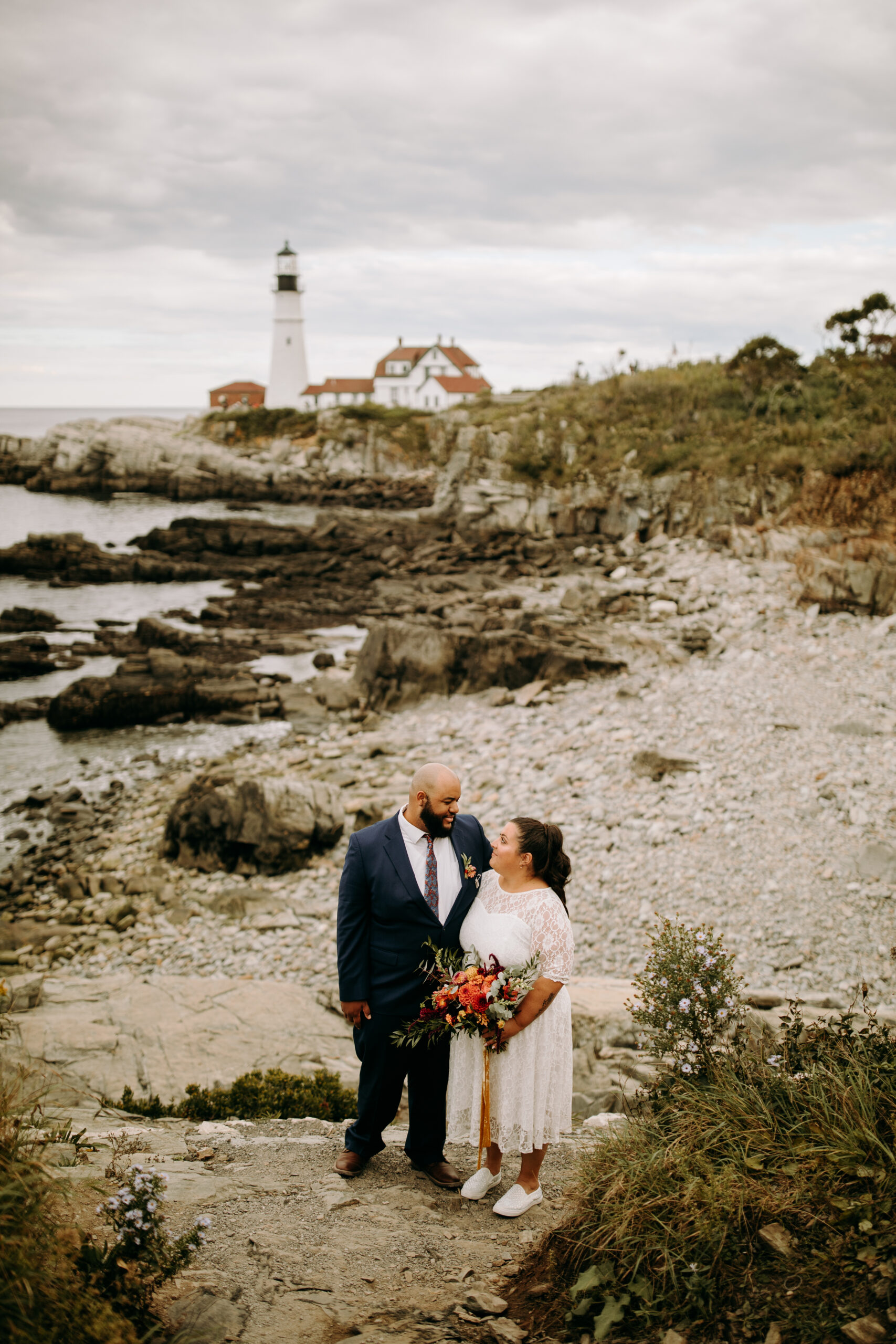 Newlyweds taking in the stunning view at Portland Head Light
