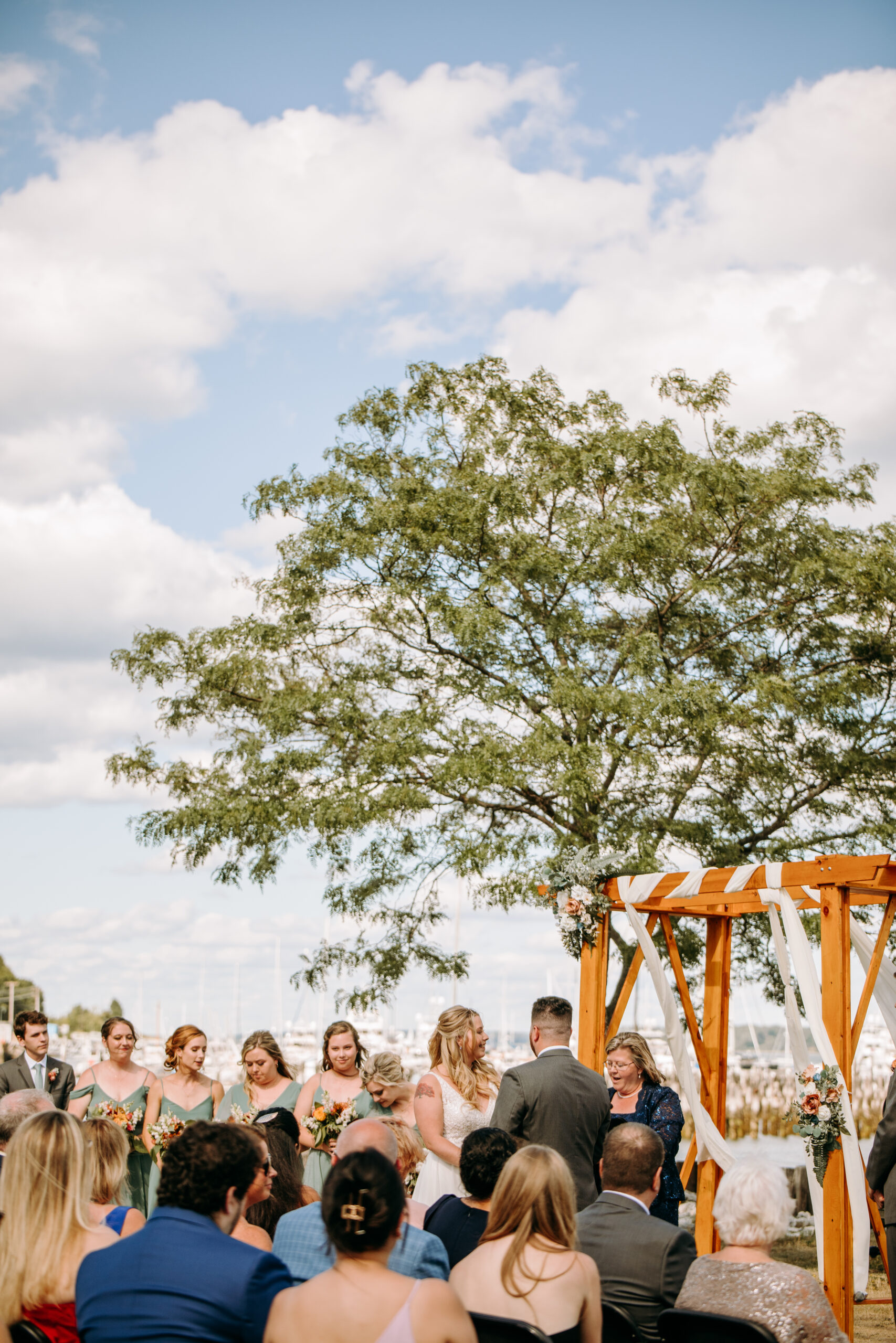 ceremony with bride and groom at Portland Ocean Gateway overlooking the portland maine harbor
