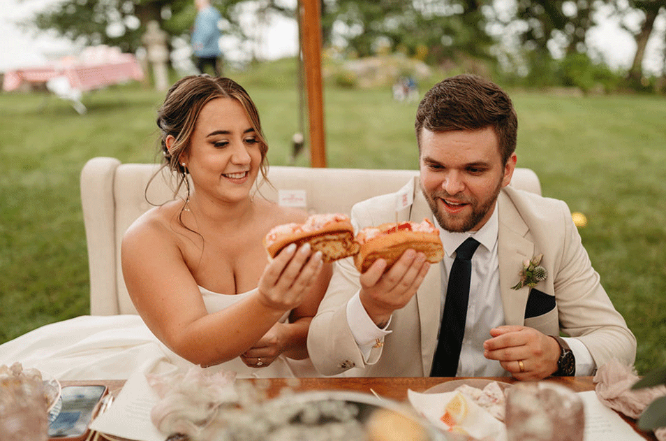 couple cheers lobster roll for maine wedding
