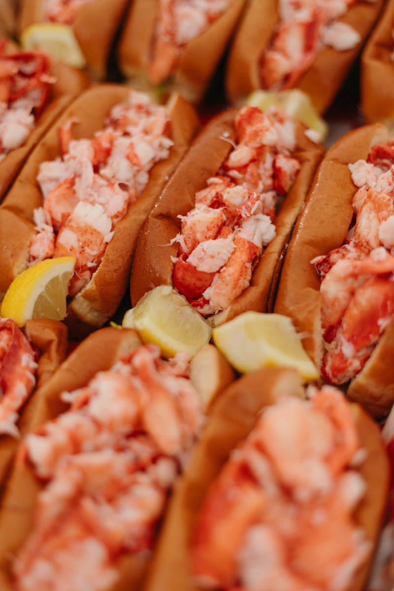 high roller lobster company lobster roll at wedding with lemon wedge
