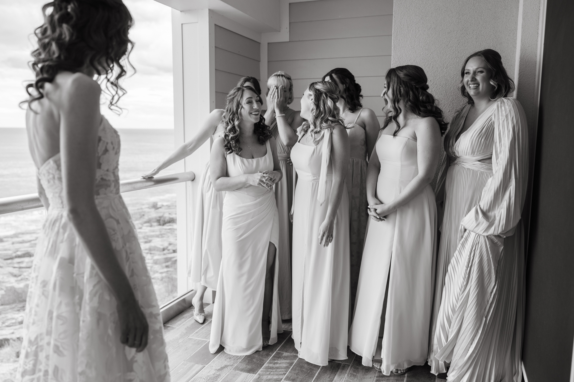bridesmaid get teary eyed at the cliff house maine during first look with bride 