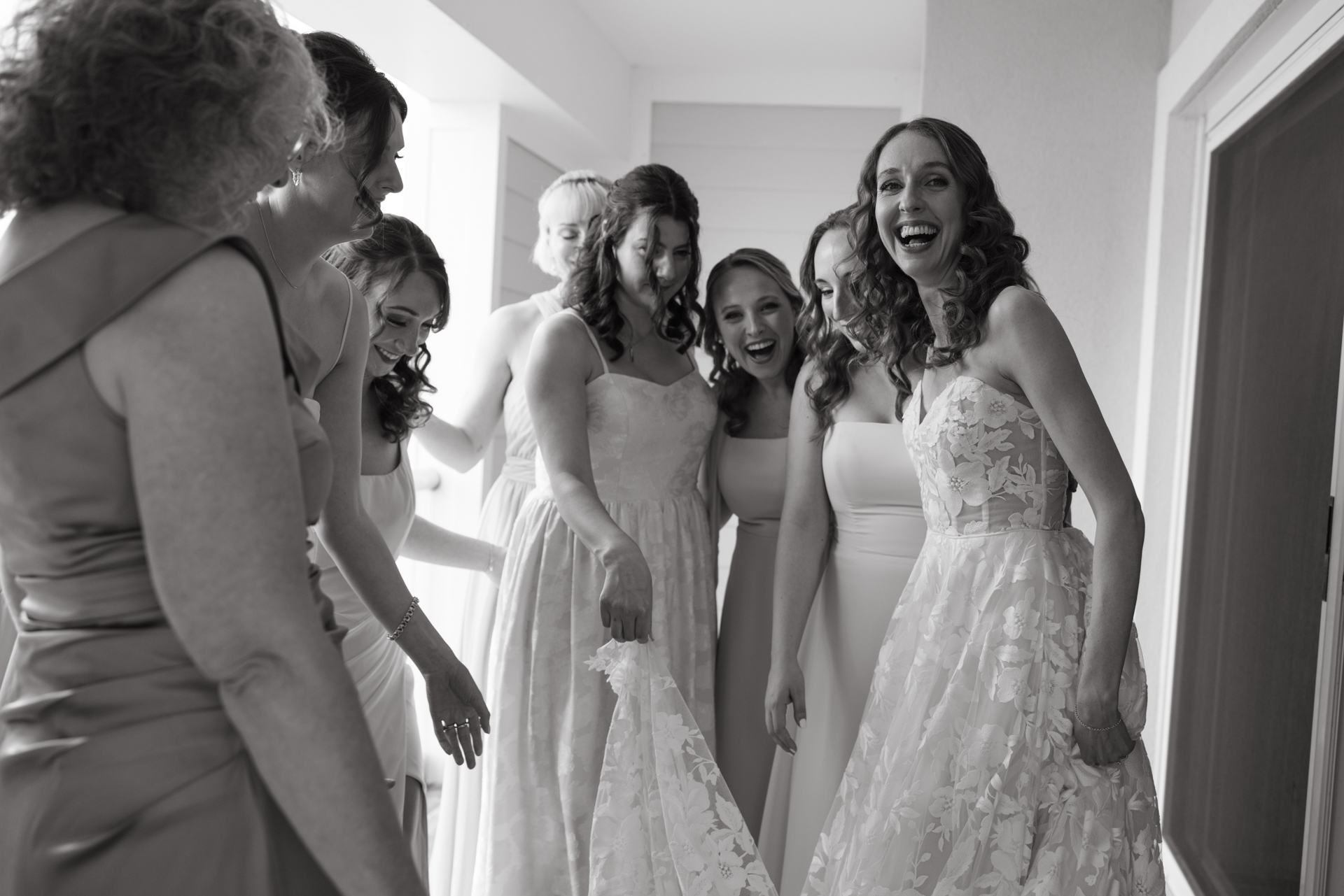 a candid moment between bridesmaids at the cliff house wedding venue in york maine 