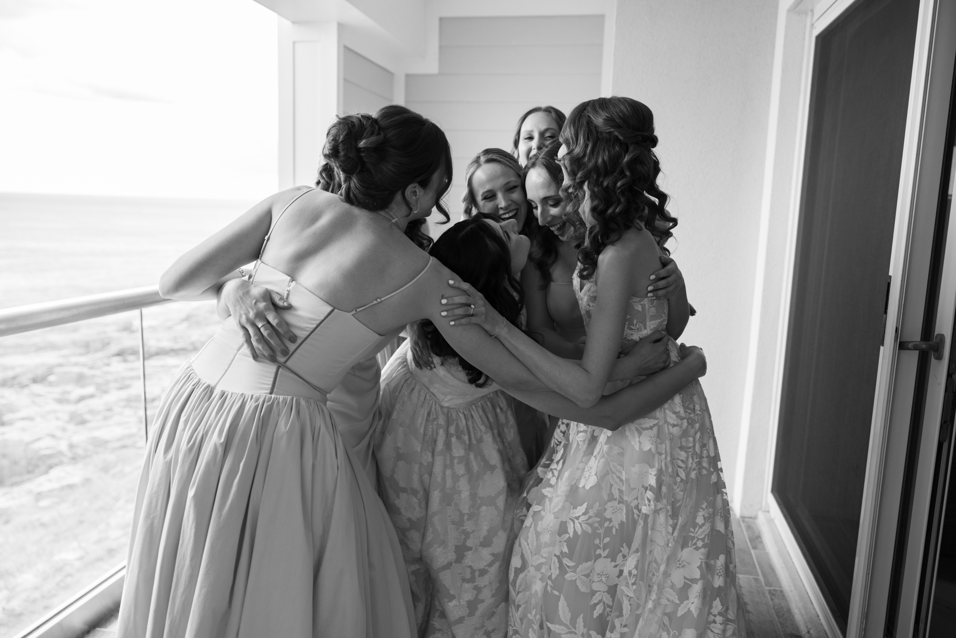 a candid moment between bridesmaids at the cliff house wedding venue in york maine 