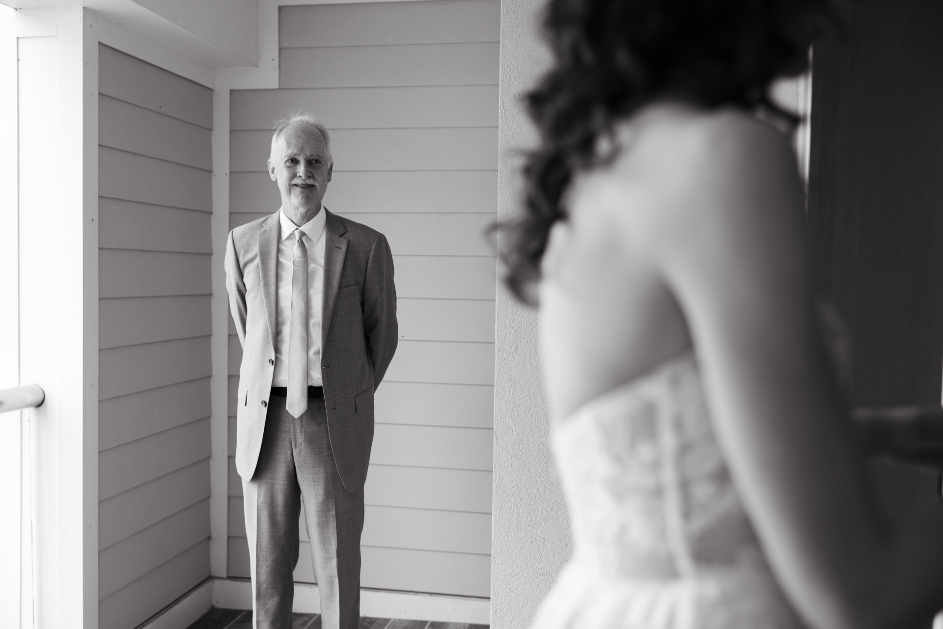 brides first look with dad at the cliff house in york maine on 35 mm film 