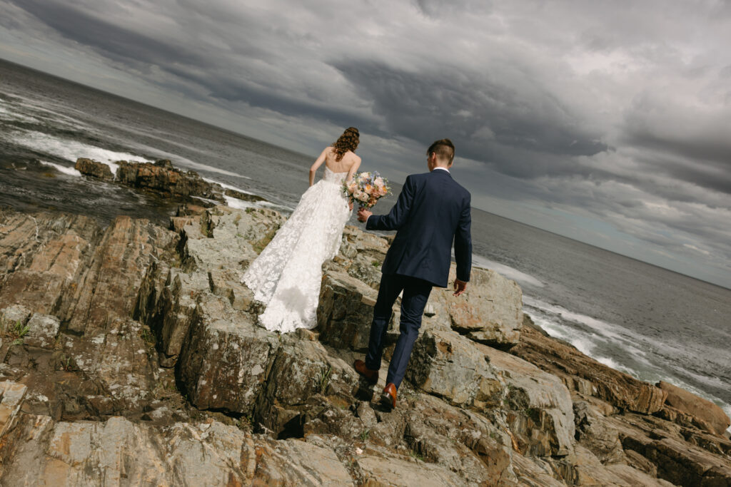 the first look on the cliffs at cliff house maine wedding venue in york maine 