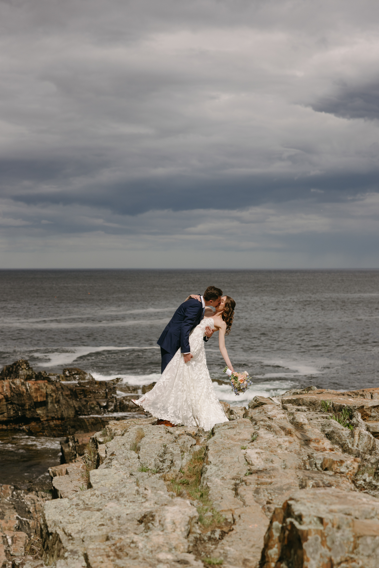the first look on the cliffs at cliff house maine wedding venue in york maine 