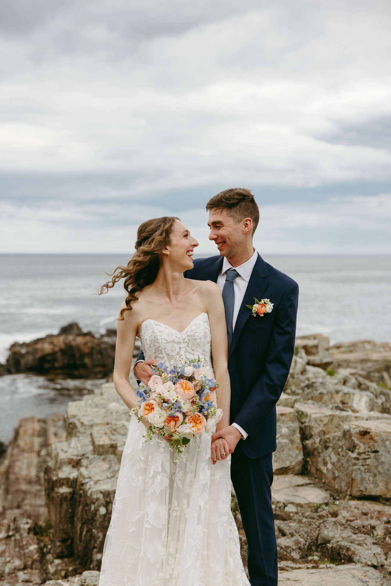 the first look on the cliffs at cliff house maine wedding venue in york maine 
