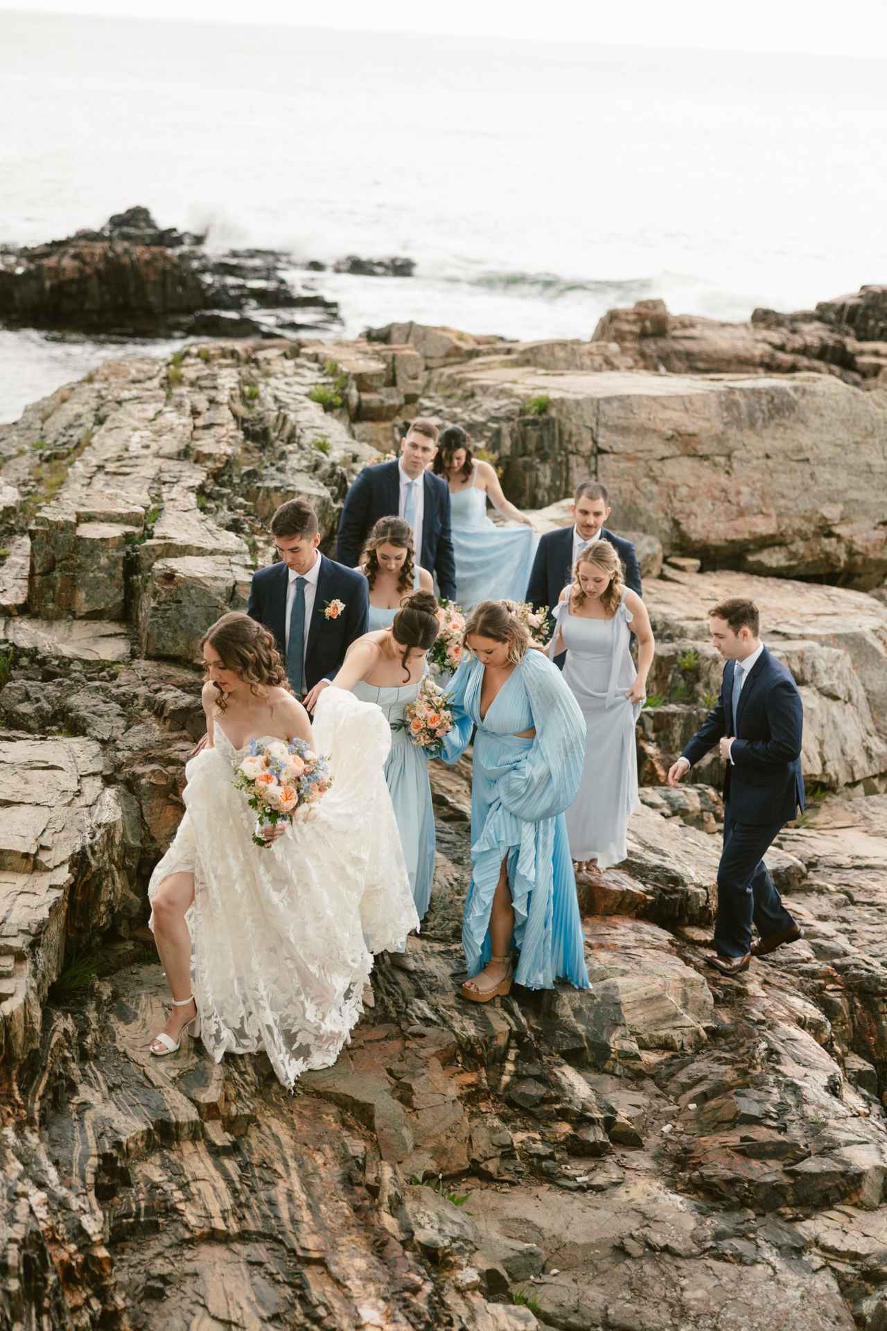 bridal portrait on the cliffs at the cliff house in maine candid