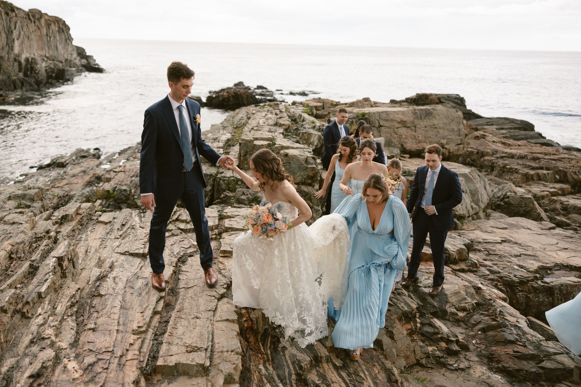 bridal portrait on the cliffs at the cliff house in maine candids
