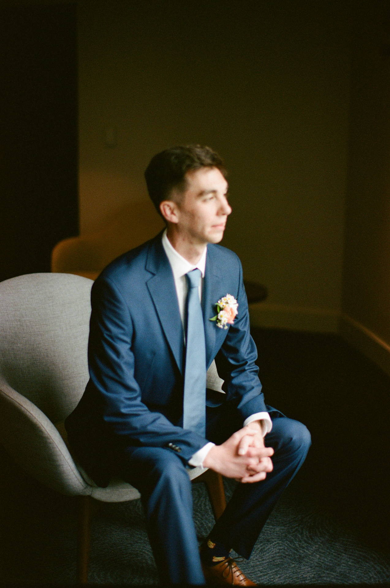 groom getting ready at the cliff house in york maine on film, medium format, 35mm film wedding photography 