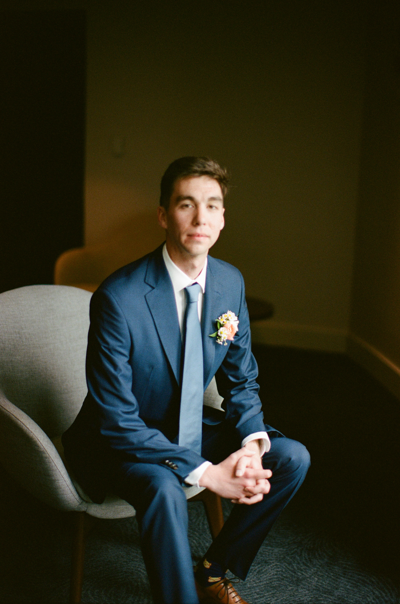 groom getting ready at the cliff house in york maine on film, medium format, 35mm film wedding photography 