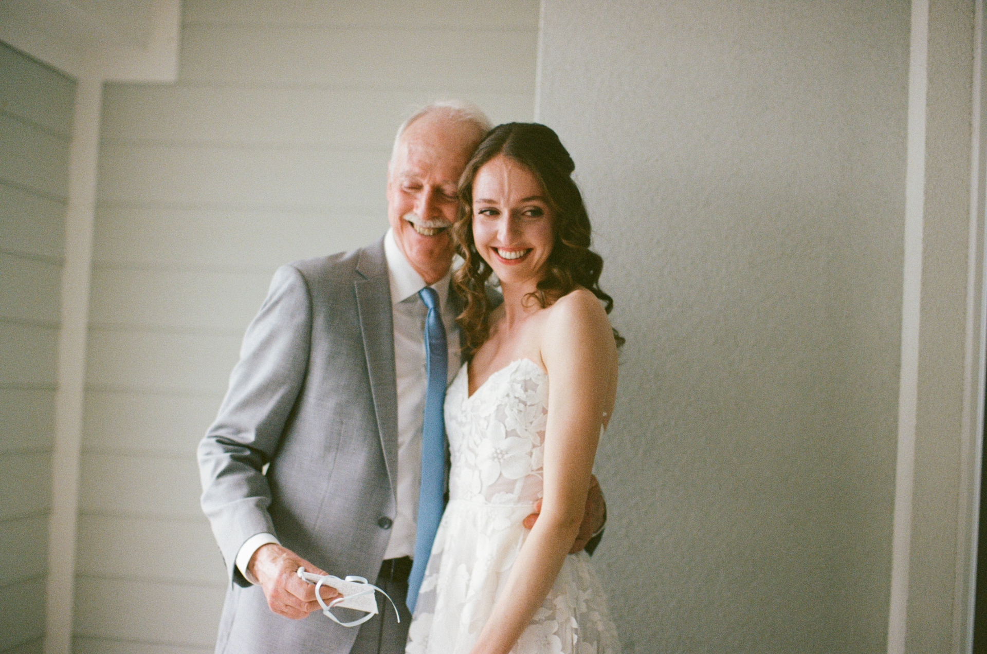 brides first look with dad at the cliff house in york maine on 35 mm film 