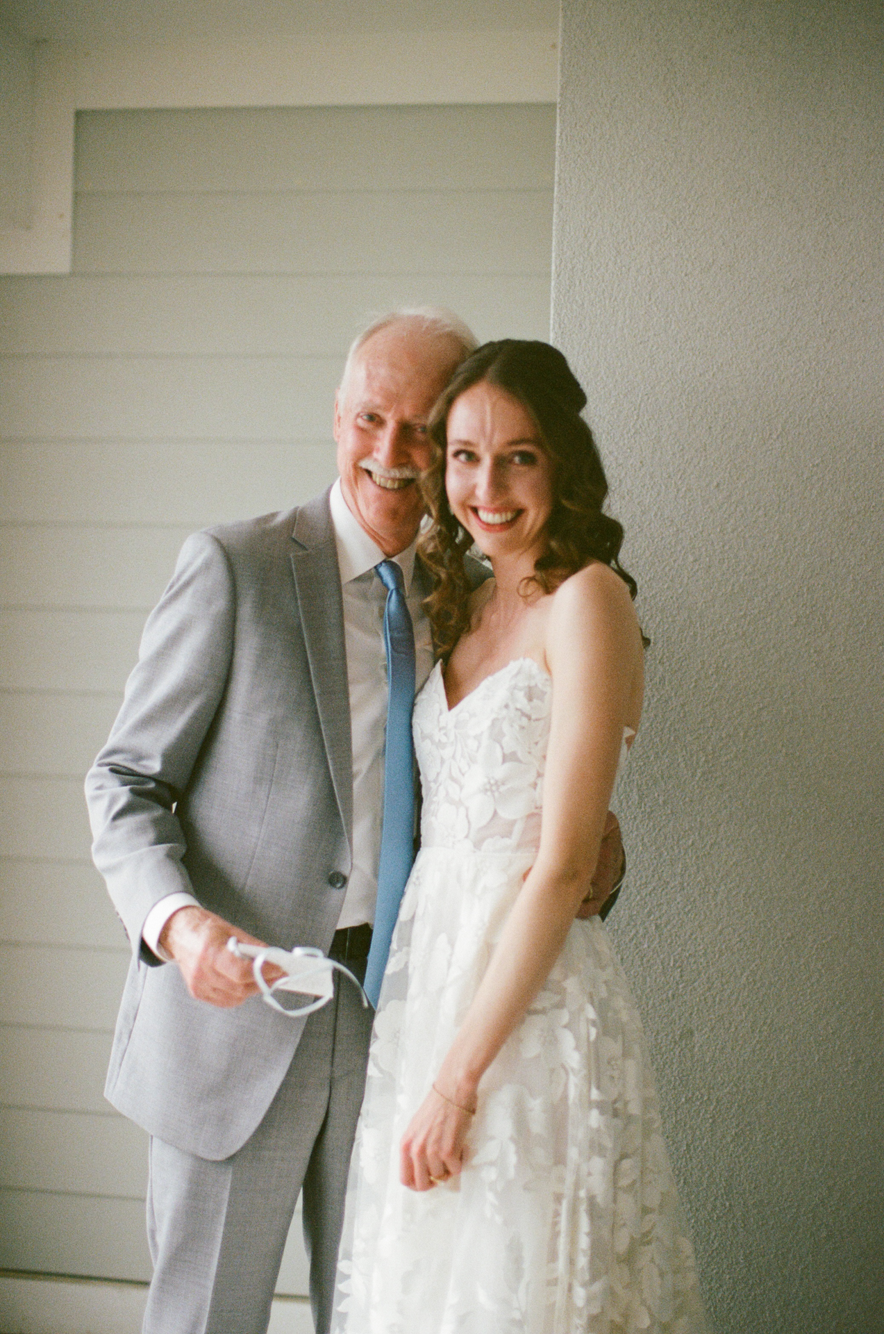 brides first look with dad at the cliff house in york maine on 35 mm film 
