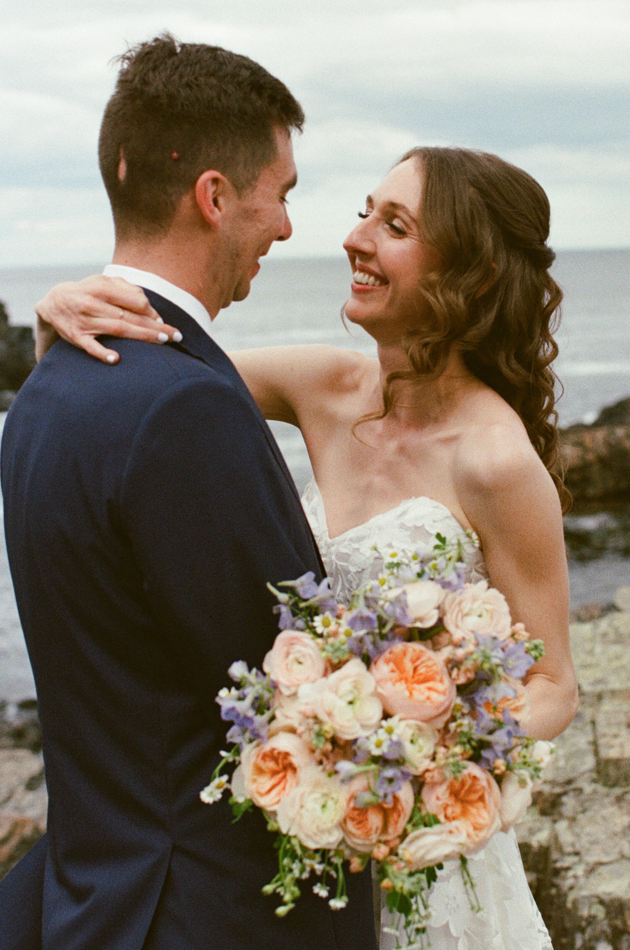 couple portraits at the cliff house wedding venue in york maine on 35mm film 