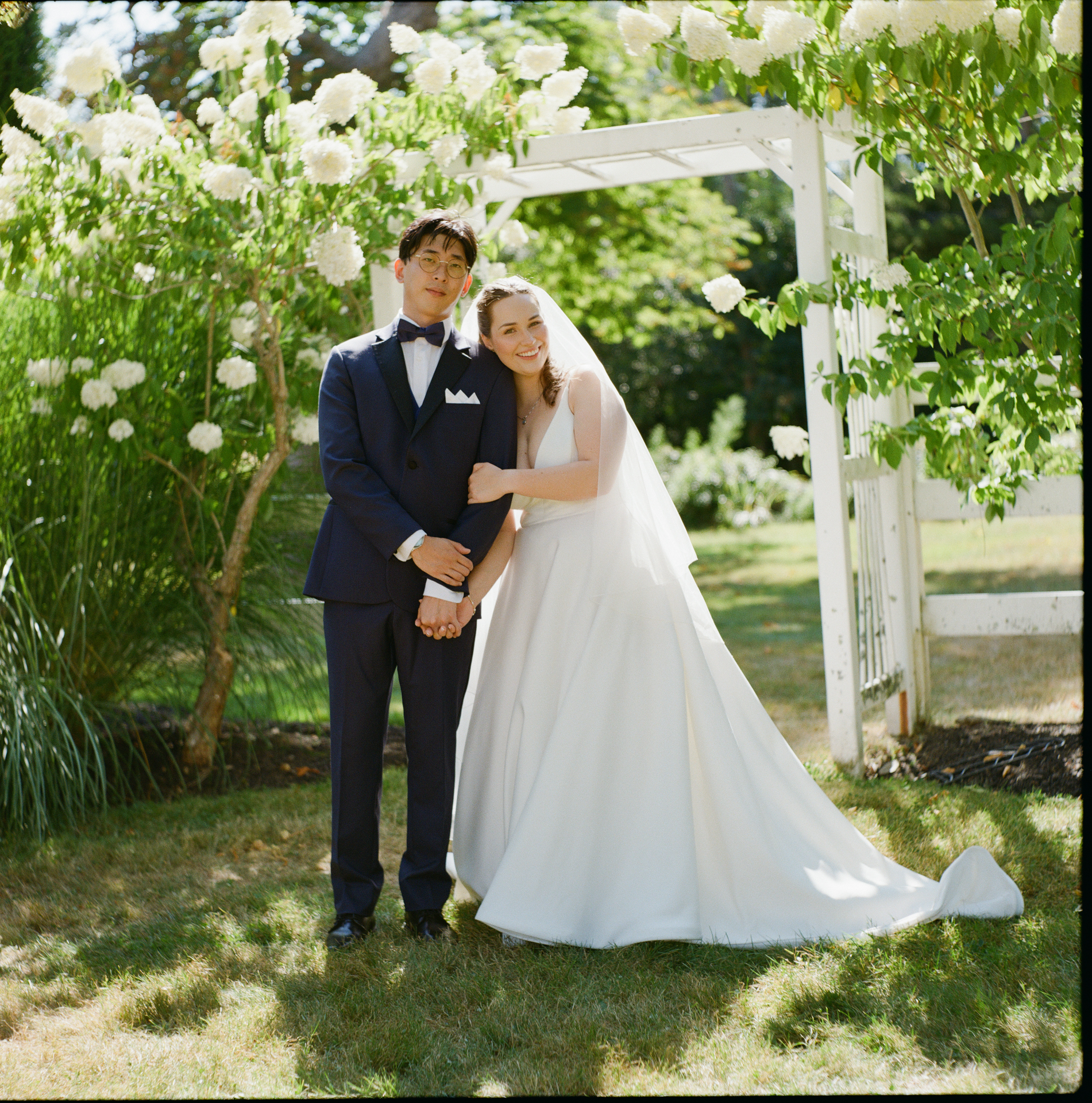 Timeless wedding portrait of couple on medium format, 120 film, at their wedding at Live Well Farm in Harpswell Maine. Taken by Emily Leonard Photography