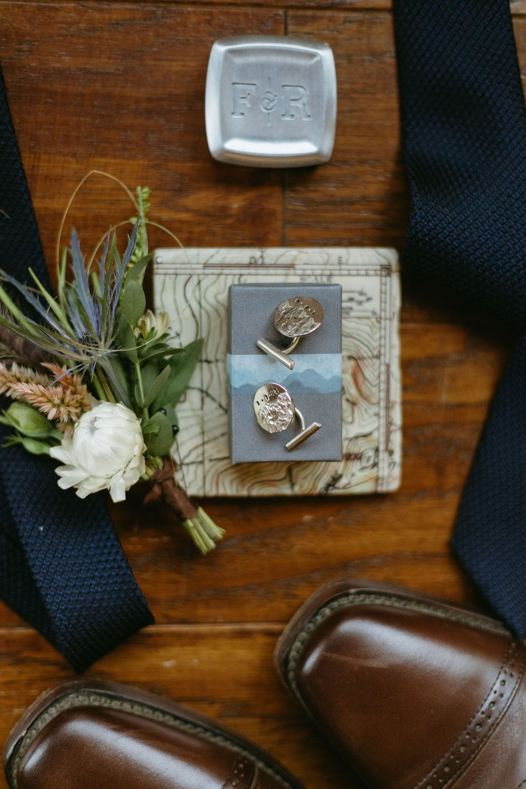 detail photos of tie, cufflinks, boutonniere & shoes