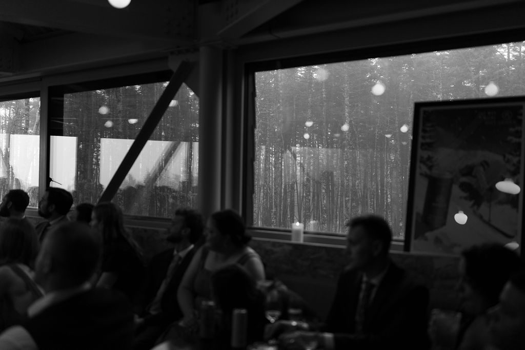 moody indoor photo through the glass at The Nest at Saddleback Mountain. Black and white rainy foggy photo 